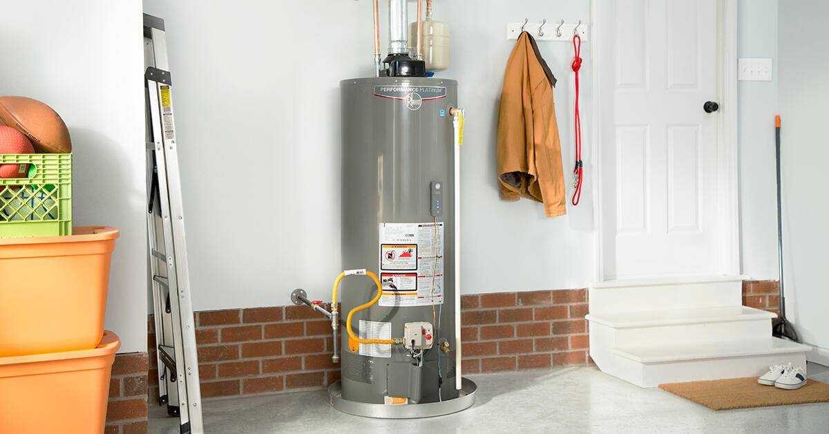 Tank gas water heater installed in a home utility area